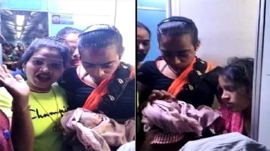 Eunuchs came forward to help the woman who was moaning due to labor pain, got the delivery done in a moving train