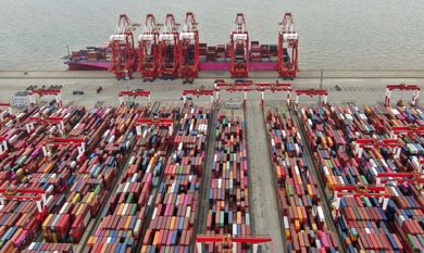 FILE - The Yangshan container port is seen in an aerial view in Shanghai, China on July 10, 2021. China’s exports tumbled in June, 2023, by 12.4% compared with a year earlier amid weaker global demand and higher inflation. (Chinatopix via AP, File)