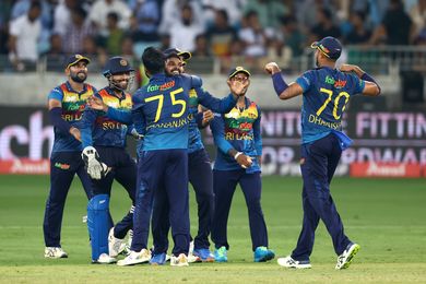 DUBAI, UNITED ARAB EMIRATES - SEPTEMBER 11: Wanindu Hasaranga of Sri Lanka celebrates with team mates during the DP World Asia Cup Final match between Pakistan and Sri Lanka at Dubai International Stadium on September 11, 2022 in Dubai, United Arab Emirates. (Photo by Francois Nel/Getty Images)