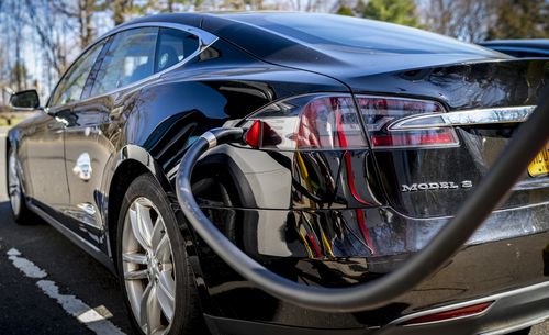 GREENWICH, CONNECTICUT - APRIL 9: A Tesla Model S electric car stops for recharging April 9, 2023 at a service station in Greenwich, Connecticut. The Tesla Model S can travel for 400 miles before recharging and costs $90,000. (Photo by Robert Nickelsberg/Getty Images)