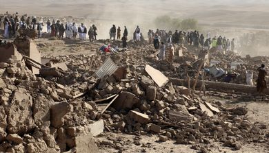 Afghan men search for victims after an earthquake in Zenda Jan district in Herat province, of western Afghanistan, Sunday, Oct. 8, 2023. Powerful earthquakes killed at least 2,000 people in western Afghanistan, a Taliban government spokesman said Sunday. It's one of the deadliest earthquakes to strike the country in two decades. (AP Photo/Omid Haqjoo)