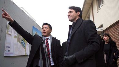 Prime Minister Justin Trudeau (right) stands with Jason Chen, Development Director at Toronto Community Housing as he visits a housing development in Toronto's Lawrence Heights neighbourhood ahead of a policy announcement, on Wednesday November 22, 2017. THE CANADIAN PRESS/Chris Young