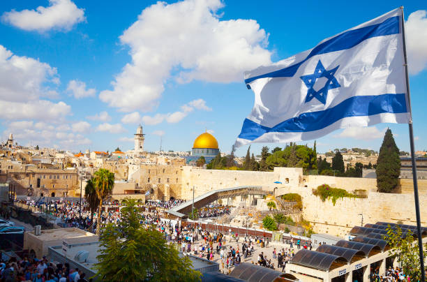 Israel flag with a view of old city Jerusalem and the KOTEL- Western wall