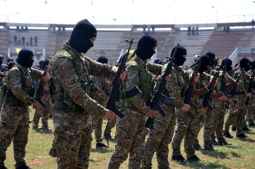 Members of Syrian Democratic Forces (SDF) attend the funeral procession of their comrades, who were killed in a helicopter that crashed in northern Iraq, in Qamishli city, northeast of Syria, 22 March 2023. EFE/EPA/FILE/AHMED MARDNLI